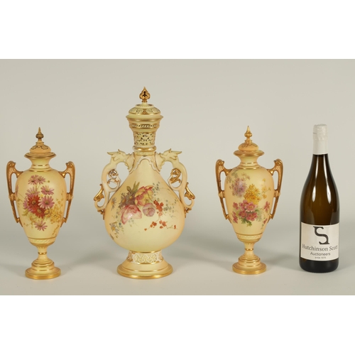 77 - AN ORNATE ROYAL WORCESTER GILT AND IVORY GROUND SCROLLED TWO-HANDLED CABINET VASE AND COVER of bulbo... 