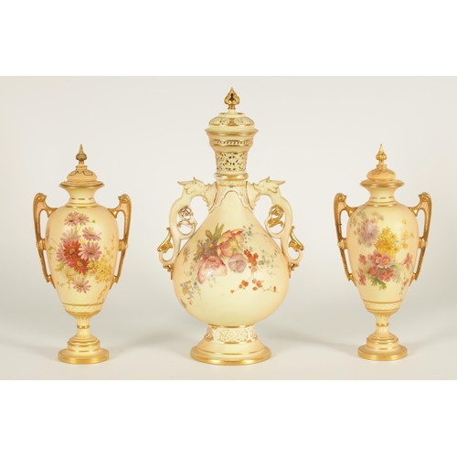 77 - AN ORNATE ROYAL WORCESTER GILT AND IVORY GROUND SCROLLED TWO-HANDLED CABINET VASE AND COVER of bulbo... 