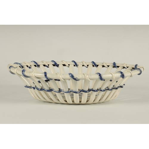 80 - AN 18TH CENTURY PEARLWARE BLUE AND WHITE OVAL LATTICEWORK BASKET of bound form with woven base. (26c... 