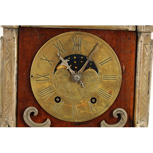 901 - AN UNUSUAL FRENCH ARTS AND CRAFTS MANTEL CLOCK WITH AXE MOON AND CALENDAR DIAL the 4.5