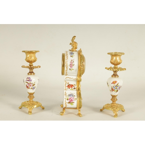 909 - A LATE 19TH CENTURY FRENCH BOUDOIR CLOCK GARNITURE the ormolu mounted floral porcelain case with cla... 