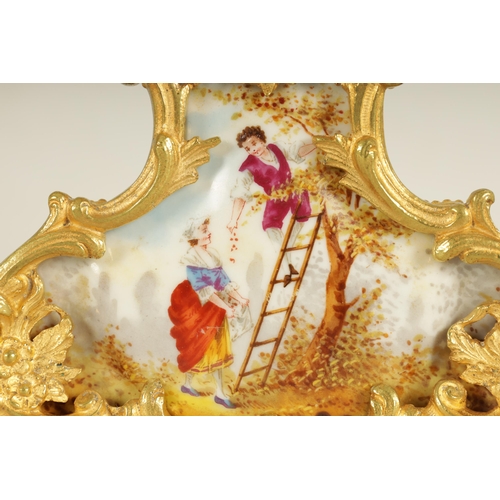 909 - A LATE 19TH CENTURY FRENCH BOUDOIR CLOCK GARNITURE the ormolu mounted floral porcelain case with cla... 