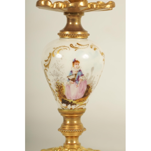 909 - A LATE 19TH CENTURY FRENCH BOUDOIR CLOCK GARNITURE the ormolu mounted floral porcelain case with cla... 