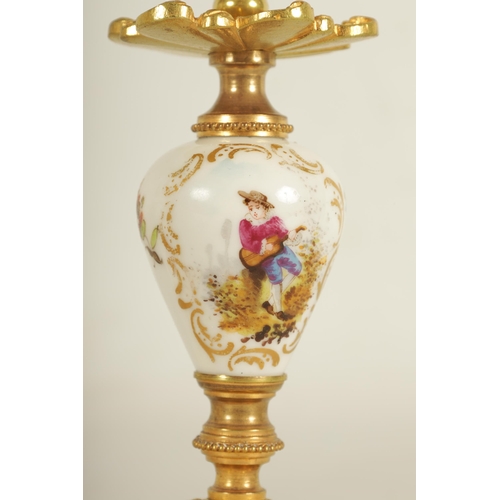 909 - A LATE 19TH CENTURY FRENCH BOUDOIR CLOCK GARNITURE the ormolu mounted floral porcelain case with cla... 