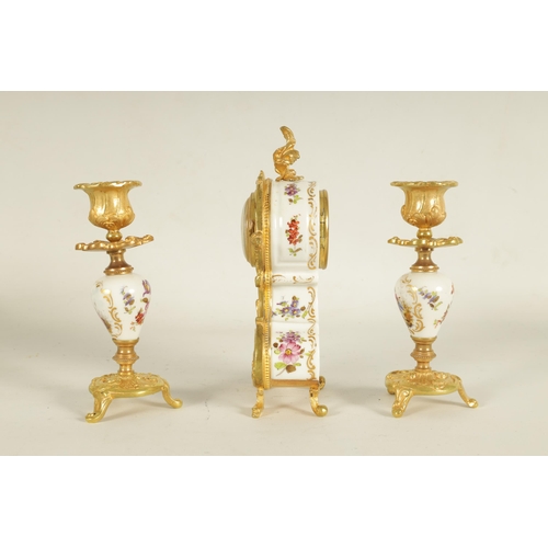 909 - A LATE 19TH CENTURY FRENCH BOUDOIR CLOCK GARNITURE the ormolu mounted floral porcelain case with cla... 