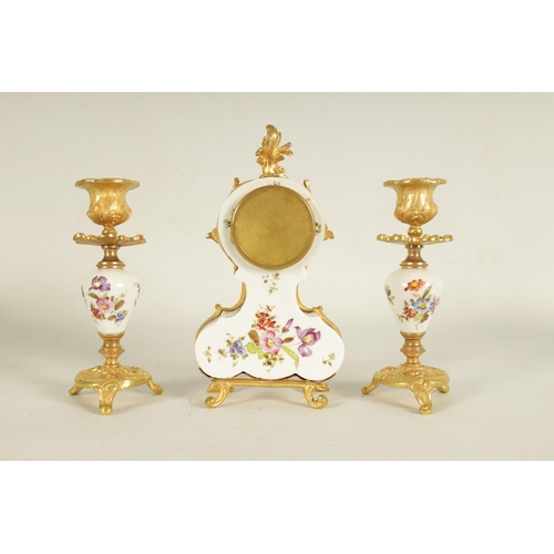 909 - A LATE 19TH CENTURY FRENCH BOUDOIR CLOCK GARNITURE the ormolu mounted floral porcelain case with cla... 