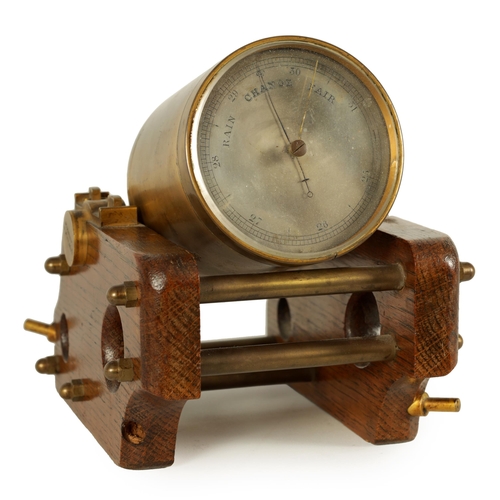 917 - A 19TH CENTURY GILT BRASS AND OAK NOVELTY DESK BAROMETER SIGNED W. THORN, 4 PALL MALL. Modelled as a... 