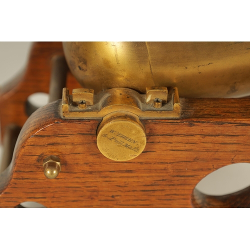 917 - A 19TH CENTURY GILT BRASS AND OAK NOVELTY DESK BAROMETER SIGNED W. THORN, 4 PALL MALL. Modelled as a... 