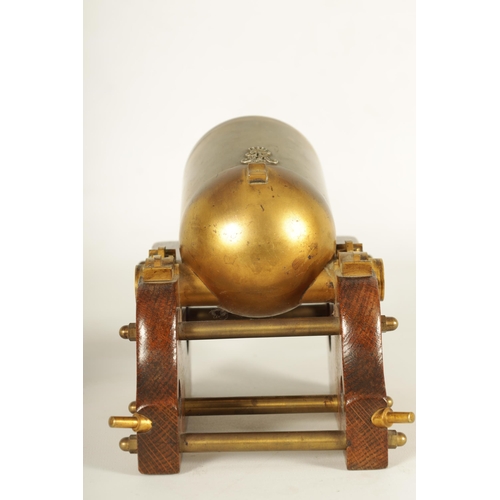 917 - A 19TH CENTURY GILT BRASS AND OAK NOVELTY DESK BAROMETER SIGNED W. THORN, 4 PALL MALL. Modelled as a... 