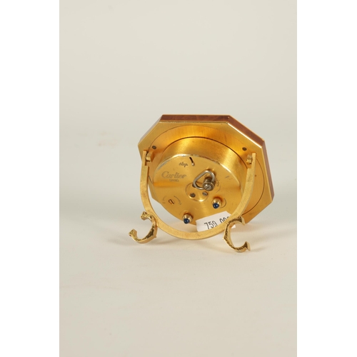 928 - A VINTAGE CARTIER OCTAGONAL GILT AND ENAMEL DESK CLOCK with winding movement with alarm function, an... 