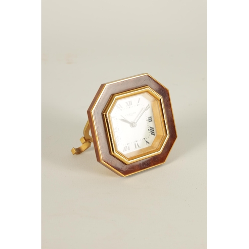 928 - A VINTAGE CARTIER OCTAGONAL GILT AND ENAMEL DESK CLOCK with winding movement with alarm function, an... 