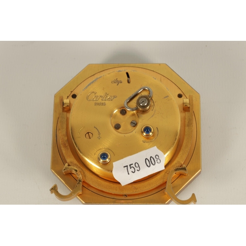 928 - A VINTAGE CARTIER OCTAGONAL GILT AND ENAMEL DESK CLOCK with winding movement with alarm function, an... 