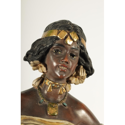 93 - A 20TH CENTURY URIELA TERRACOTTA POLYCHROME FIGURE finely modelled and coloured depicting a standing... 