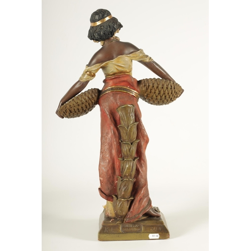 93 - A 20TH CENTURY URIELA TERRACOTTA POLYCHROME FIGURE finely modelled and coloured depicting a standing... 