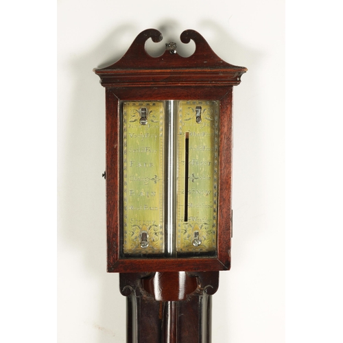 945 - A MID 18TH CENTURY PROVINCIAL MAHOGANY STICK BAROMETER the swan neck pediment above a glazed door en... 