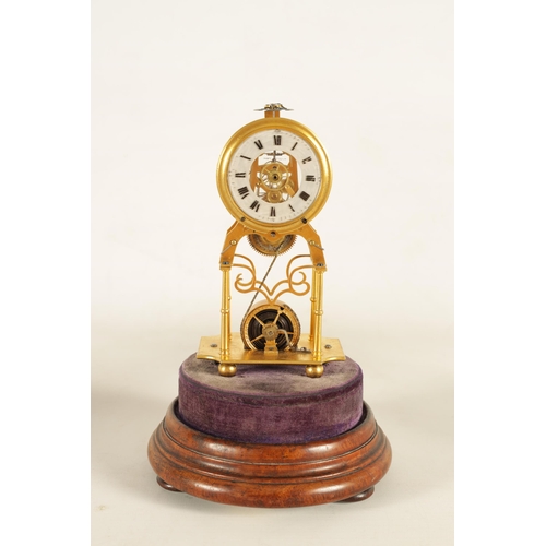 947 - A RARE 19TH CENTURY MINIATURE ENGLISH GILT BRASS SKELETON CLOCK the finely pierced frame supported o... 