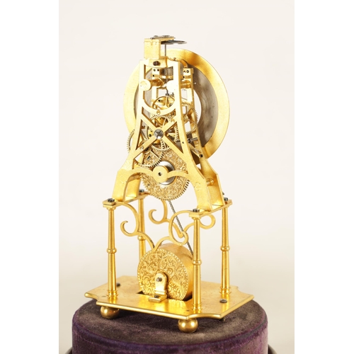 947 - A RARE 19TH CENTURY MINIATURE ENGLISH GILT BRASS SKELETON CLOCK the finely pierced frame supported o... 