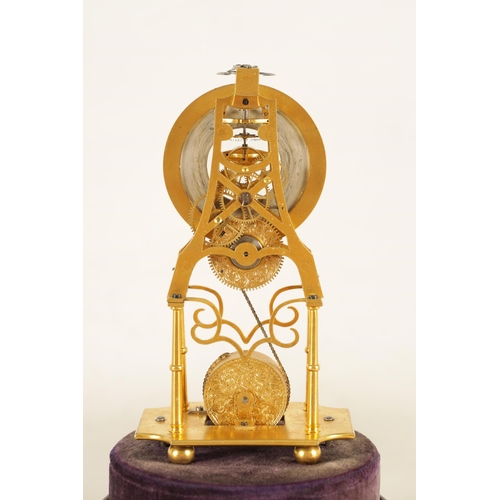 947 - A RARE 19TH CENTURY MINIATURE ENGLISH GILT BRASS SKELETON CLOCK the finely pierced frame supported o... 