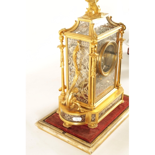 951 - A LATE 19TH CENTURY FRENCH GLAZED ORMOLU MANTEL CLOCK The case surmounted by two ormolu cherubs abov... 