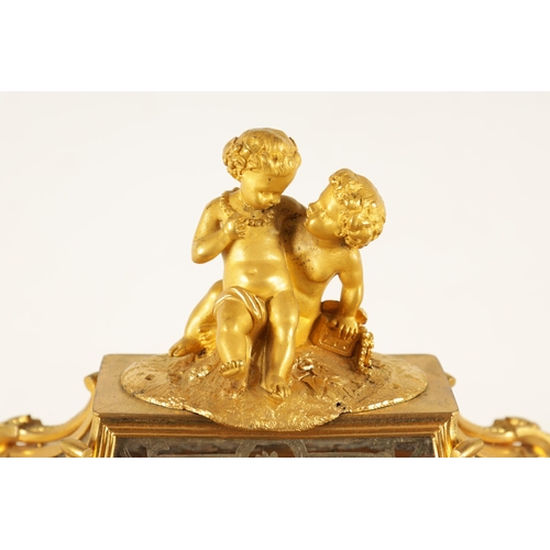 951 - A LATE 19TH CENTURY FRENCH GLAZED ORMOLU MANTEL CLOCK The case surmounted by two ormolu cherubs abov... 