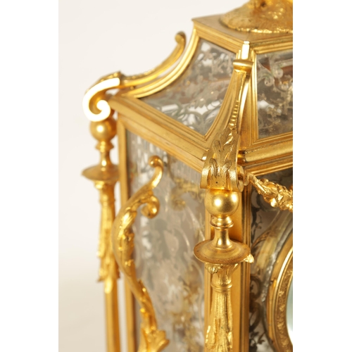 951 - A LATE 19TH CENTURY FRENCH GLAZED ORMOLU MANTEL CLOCK The case surmounted by two ormolu cherubs abov... 