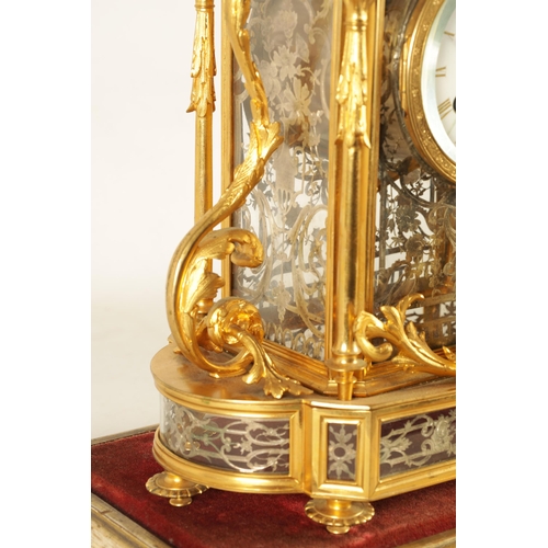 951 - A LATE 19TH CENTURY FRENCH GLAZED ORMOLU MANTEL CLOCK The case surmounted by two ormolu cherubs abov... 