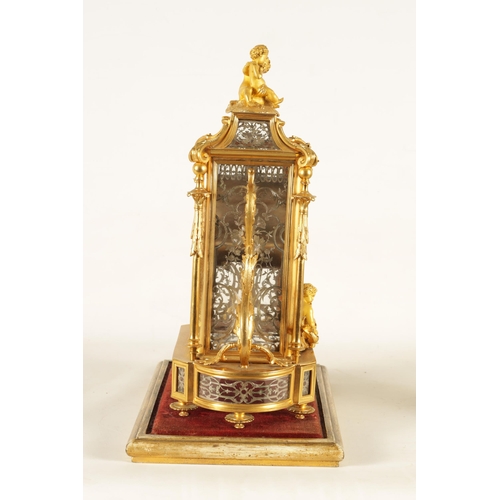 951 - A LATE 19TH CENTURY FRENCH GLAZED ORMOLU MANTEL CLOCK The case surmounted by two ormolu cherubs abov... 