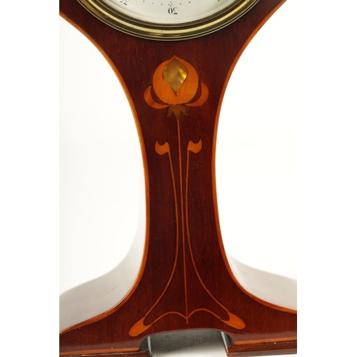 952 - AN EDWARDIAN ART NOUVEAU STYLE BOXWOOD STRUNG AND MAHOGANY INLAID MANTEL CLOCK the enamel Arabic dia... 