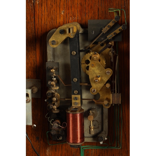 955 - AN EARLY 20TH CENTURY SILENT ELECTRIC CLOCK CO. MASTER CLOCK the oak glazed case enclosing an electr... 