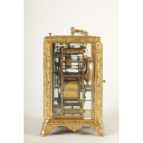 958 - A LATE 19TH CENTURY FRENCH REPEATING CARRIAGE CLOCK the gilt brass foliate relief work case with bev... 