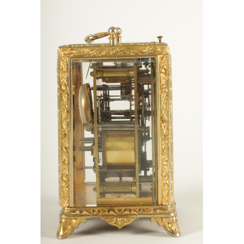 958 - A LATE 19TH CENTURY FRENCH REPEATING CARRIAGE CLOCK the gilt brass foliate relief work case with bev... 