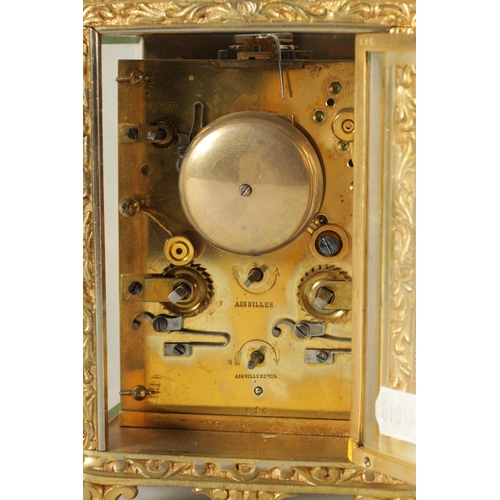 958 - A LATE 19TH CENTURY FRENCH REPEATING CARRIAGE CLOCK the gilt brass foliate relief work case with bev... 