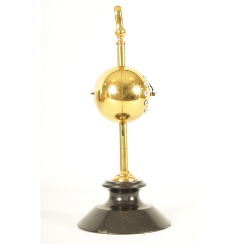 976 - AN UNUSUAL EARLY 20TH CENTURY FRENCH GRAVITY SAW CLOCK the brass spherical ball weighted case with e... 