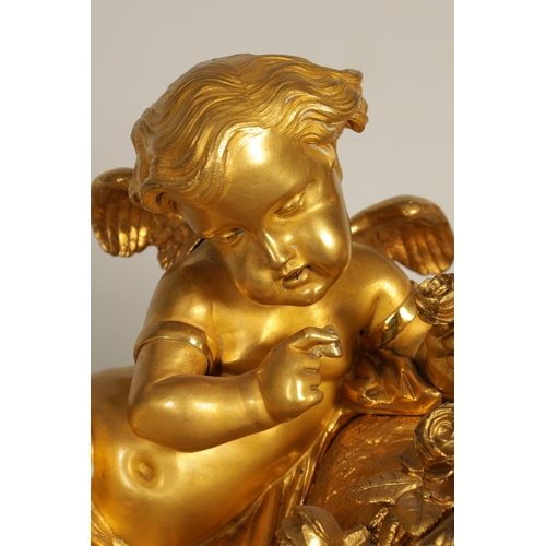 982 - A LARGE 19TH CENTURY FRENCH FIGURAL ORMOLU MANTEL CLOCK surmounted by two cherubs on a leaf work bas... 