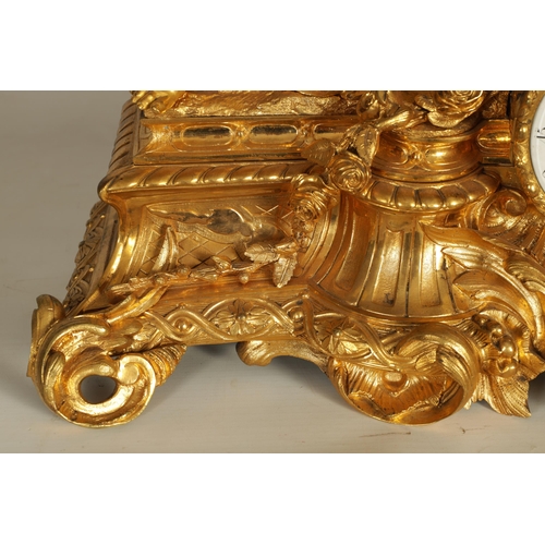 982 - A LARGE 19TH CENTURY FRENCH FIGURAL ORMOLU MANTEL CLOCK surmounted by two cherubs on a leaf work bas... 