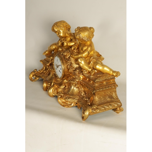 982 - A LARGE 19TH CENTURY FRENCH FIGURAL ORMOLU MANTEL CLOCK surmounted by two cherubs on a leaf work bas... 