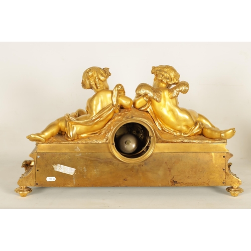 982 - A LARGE 19TH CENTURY FRENCH FIGURAL ORMOLU MANTEL CLOCK surmounted by two cherubs on a leaf work bas... 