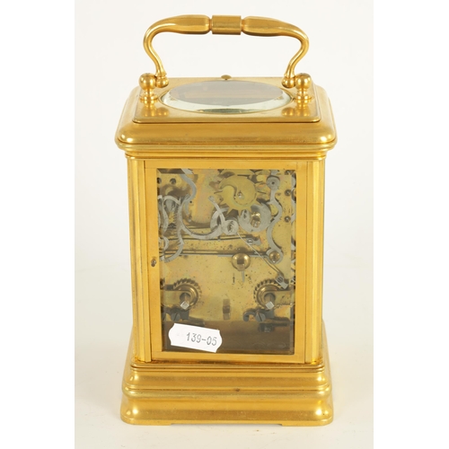 984 - AN UNUSUAL LATE 19TH CENTURY GILT BRASS GRAND SONNERIE CARRIAGE CLOCK the moulded case with rounded ... 