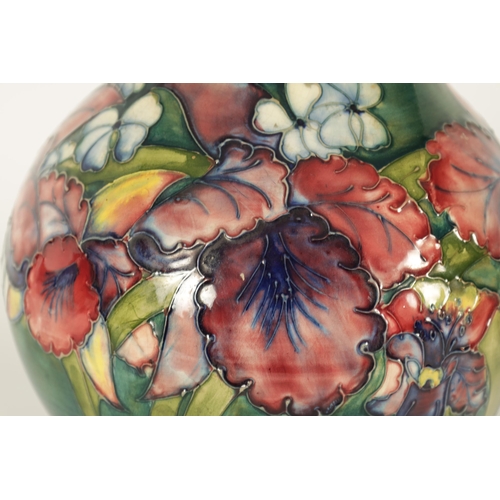 99 - A 20TH CENTURY MOORCROFT ORCHIDS PATTERN BULBOUS VASE with tube lined flower decoration Walter Moorc... 