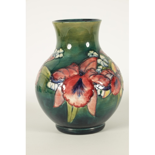 99 - A 20TH CENTURY MOORCROFT ORCHIDS PATTERN BULBOUS VASE with tube lined flower decoration Walter Moorc... 