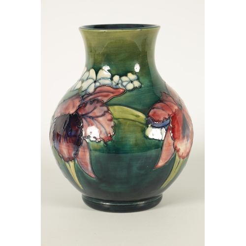 99 - A 20TH CENTURY MOORCROFT ORCHIDS PATTERN BULBOUS VASE with tube lined flower decoration Walter Moorc... 