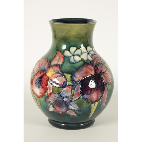 99 - A 20TH CENTURY MOORCROFT ORCHIDS PATTERN BULBOUS VASE with tube lined flower decoration Walter Moorc... 