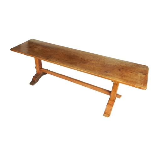 1197 - A 17TH CENTURY WALNUT TRESTLE TABLE the two piece top above square end supports with sledge feet joi... 