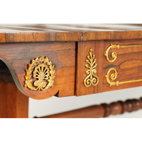 1198 - A REGENCY BRASS MOUNTED FIGURED ROSEWOOD SOFA TABLE with fold-down ends enclosing two frieze drawers... 