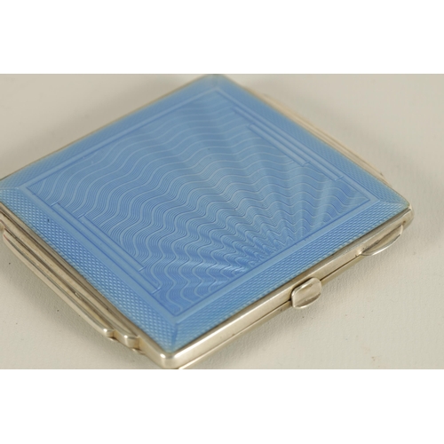 303 - AN ART DECO SILVER AND GUILLOCHE ENAMEL LADIES COMPACT with a wavy fanned design to the top opening ... 