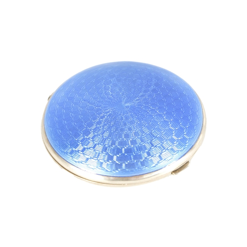 308 - A GEORGE V SILVER AND GUILLOCHE ENAMEL CIRCULAR POWDER COMPACT with geometric blue enamel pattern to... 