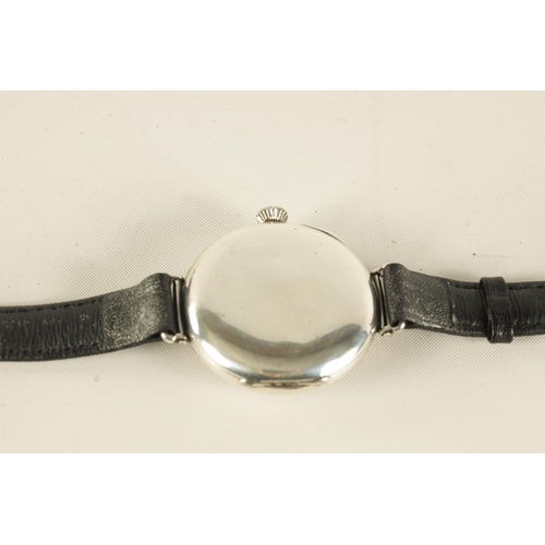 319 - A 1920s GENTLEMAN'S SILVER LONGINES WRISTWATCH on black leather strap having a circular moulded case... 