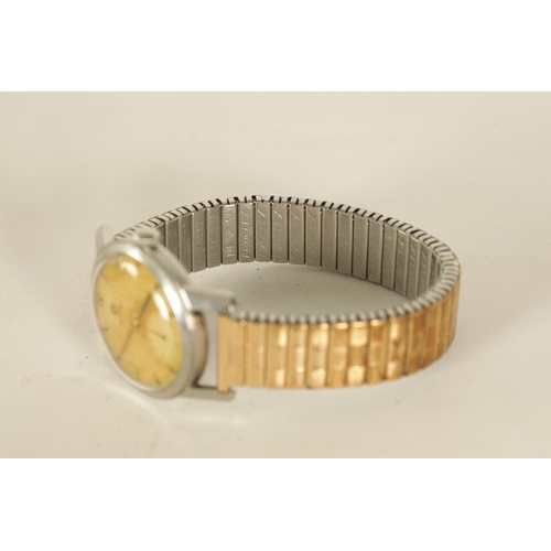 325 - A GENTLEMAN'S 1950's STEEL OMEGA WRIST WATCH on later bracelet, the discoloured champagne dial with ... 