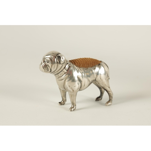 340 - A VICTORIAN SMALL SILVER PIN CUSHION IN THE FORM OF A BULLDOG modelled in a standing position with c... 