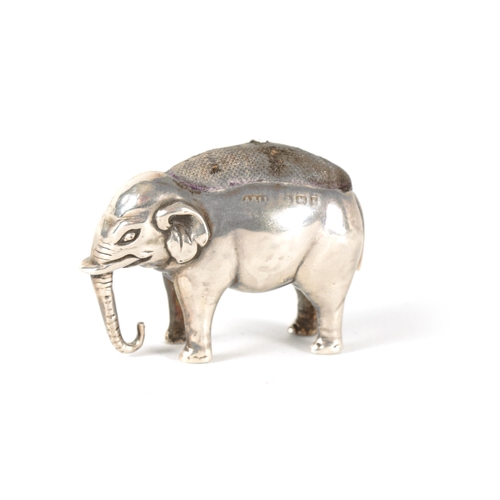 341 - AN EDWARD VII SMALL SILVER PIN CUSHION IN THE FORM OF AN ELEPHANT with the original cushion, Adie an... 